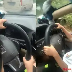  男子抱娃让其独握方向盘开车还发视频炫耀被罚款